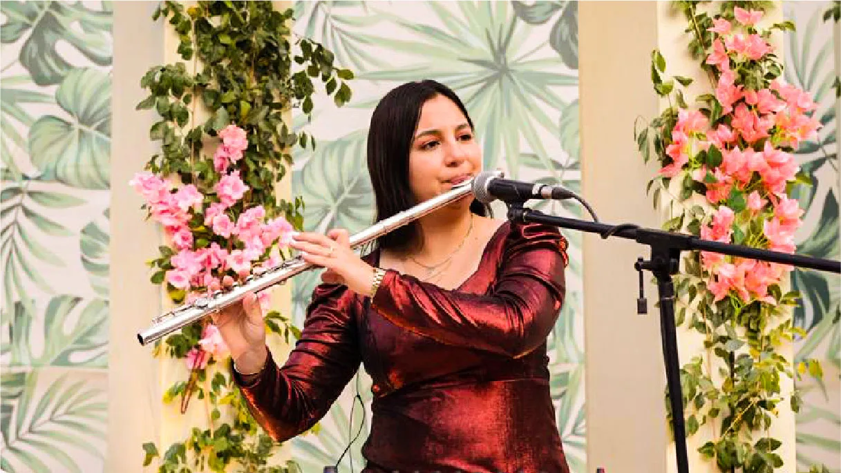International flautist performing a background set at an Indian wedding function
